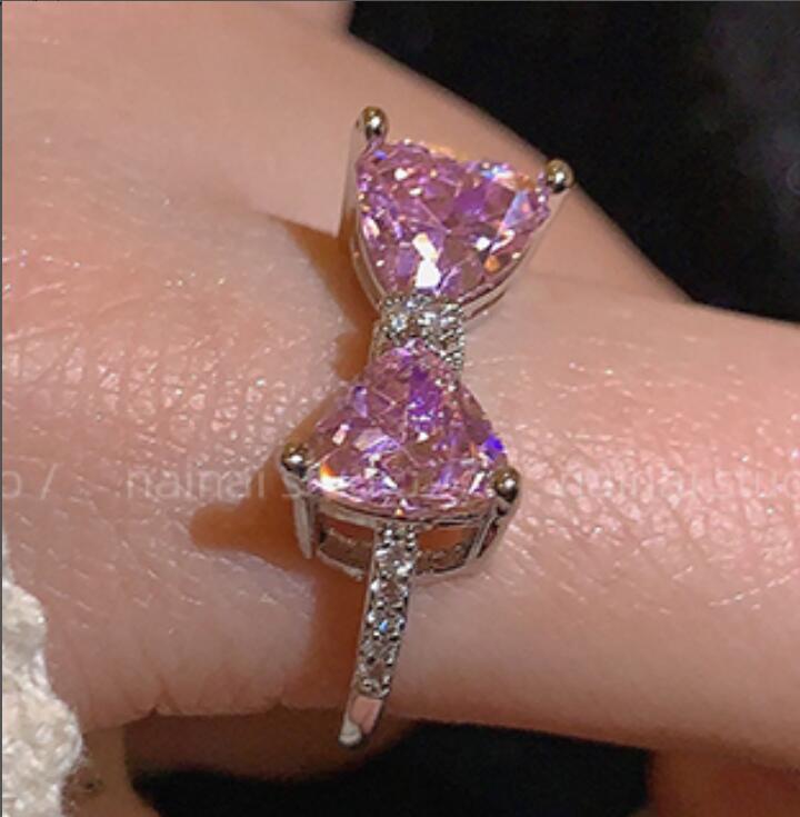 Pink gemstone ring on a finger