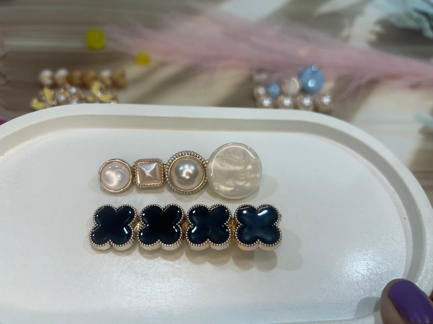 Set of Hair clip on a white tray with blurred background
