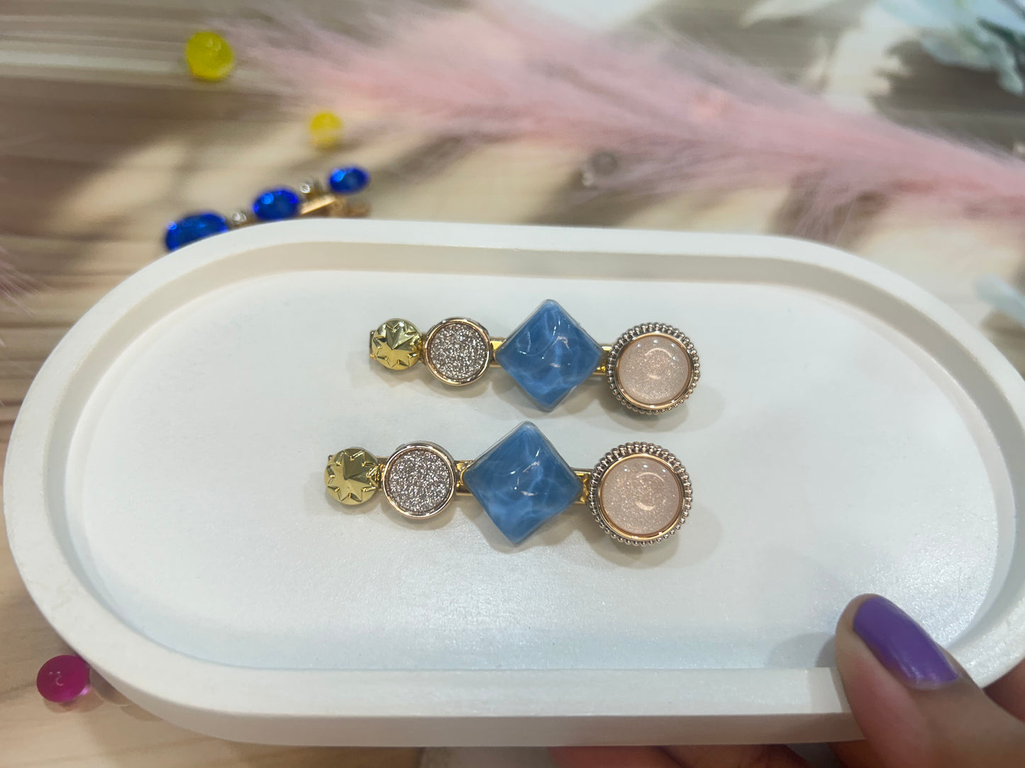 Set of hair clip on a white tray with a blurred background