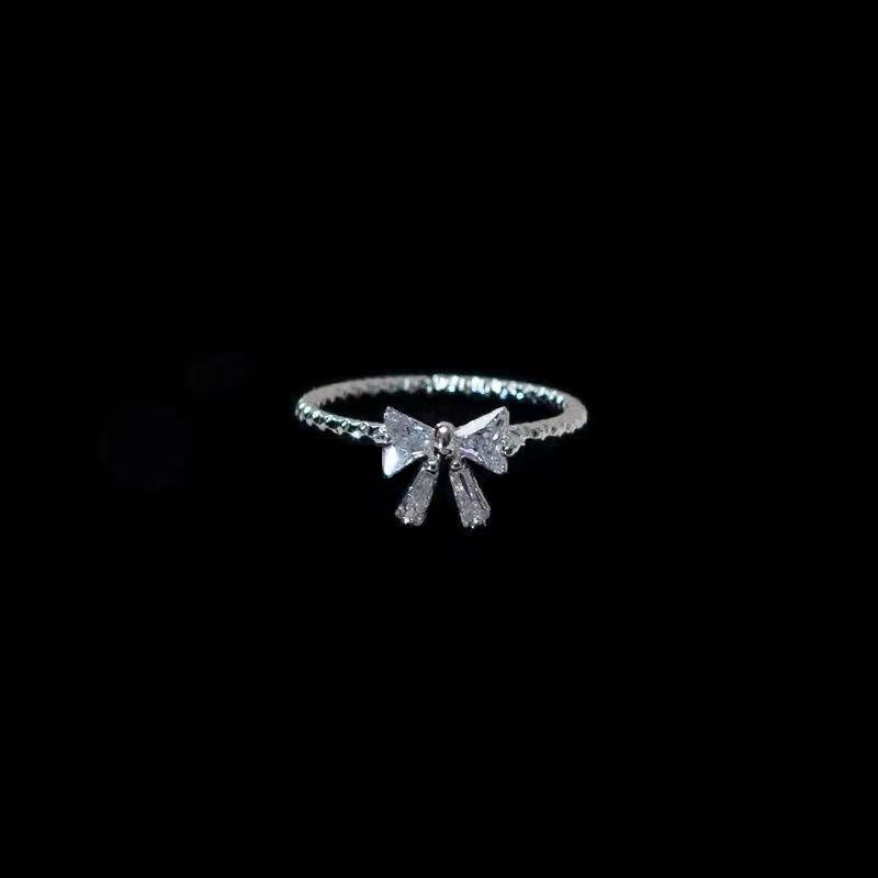 Dainty Crystal Bow Ring – Elegant Silver Ribbon Band
