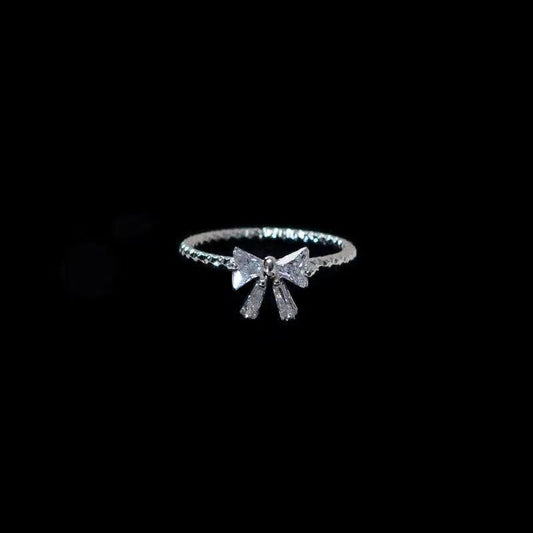 Dainty Crystal Bow Ring – Elegant Silver Ribbon Band