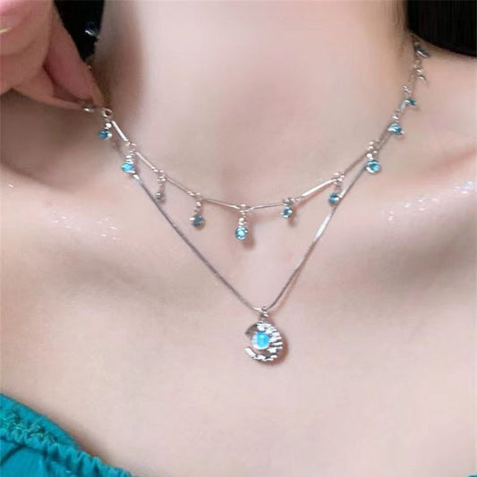 Necklace with blue stones worn by a person