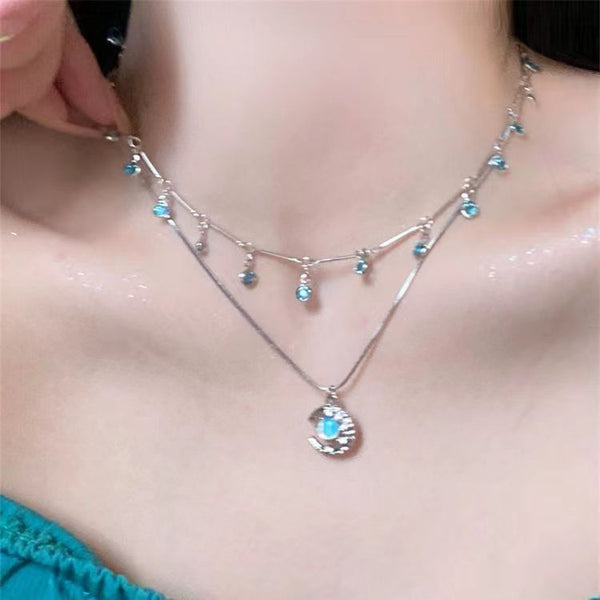 Necklace with blue stones worn by a person