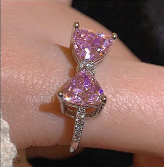 Pink gemstone ring on a finger