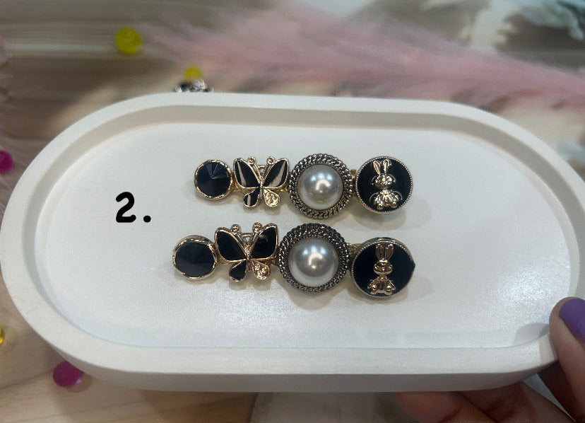 Set of hairclip on a white tray with a blurred background