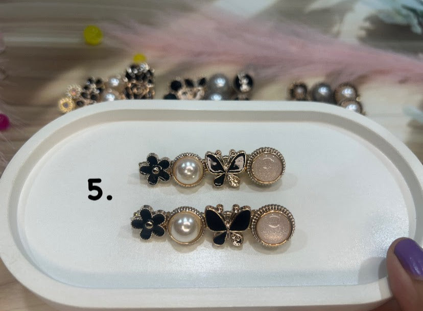 Set of hair clip on a white tray with a blurred background