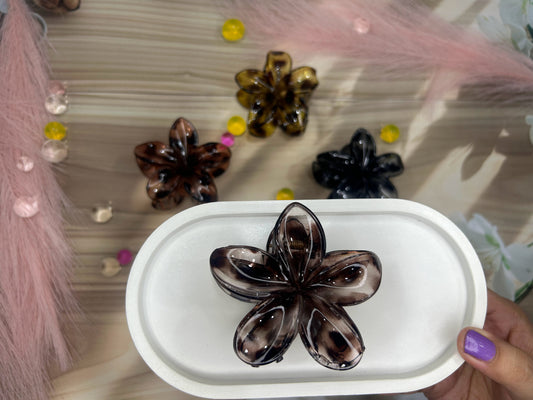 Hair accessories on a white tray with a blurred background