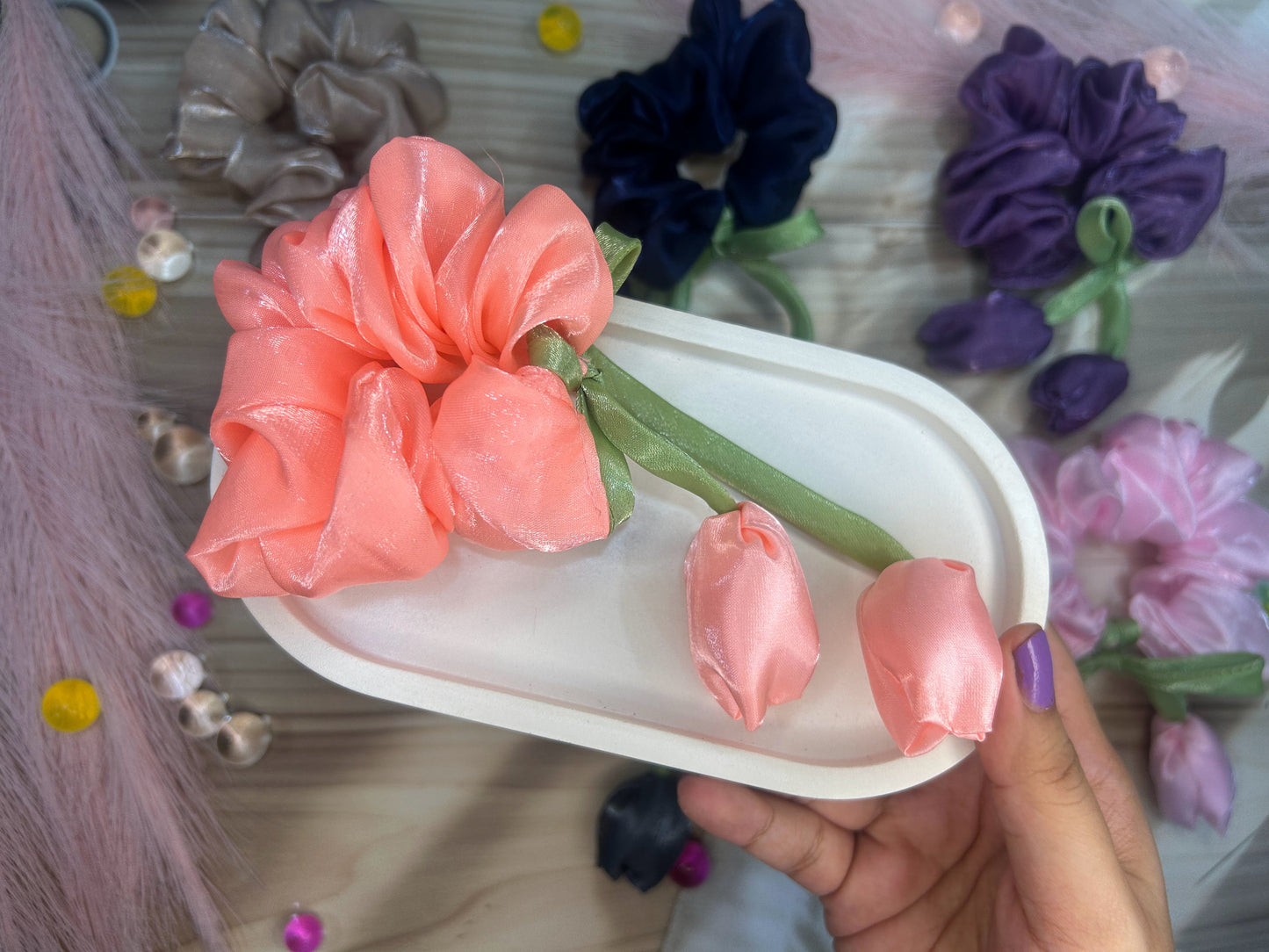 Hand holding a tulip scrunchy