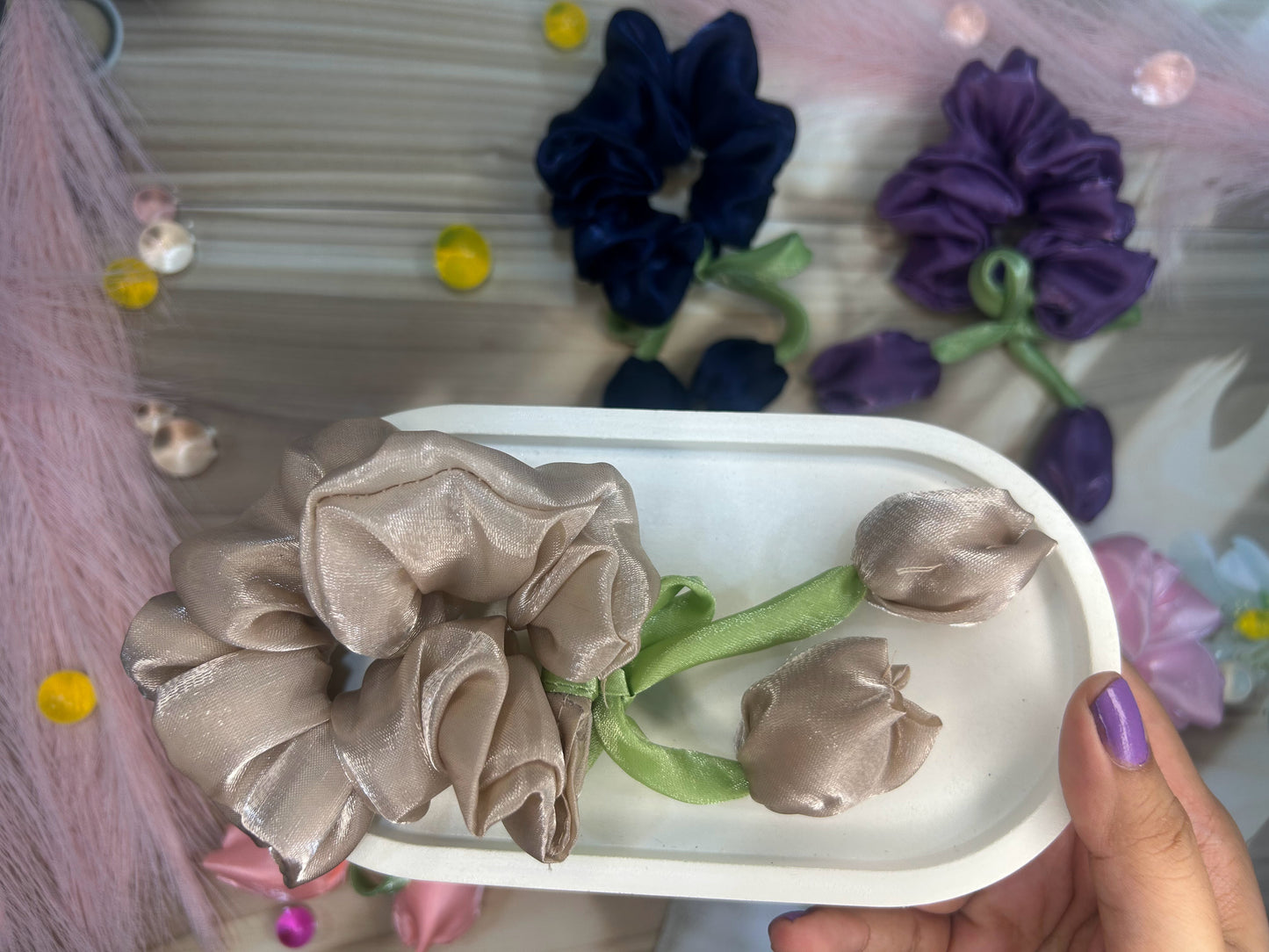 Hand holding a tulip scrunchy