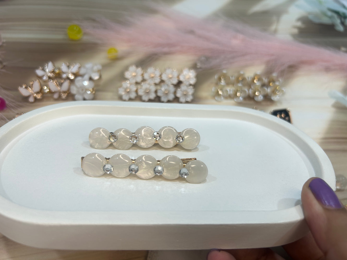 Set of hair clip on a white tray with a blurred background