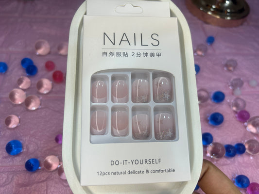 Packaging of nail stickers with confetti in the background