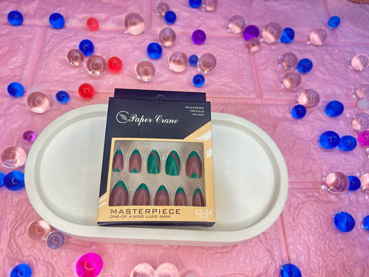 Box of false nails with a colorful bead background