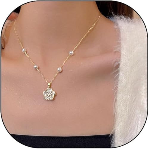 Gold necklace with a floral pendant on a mannequin